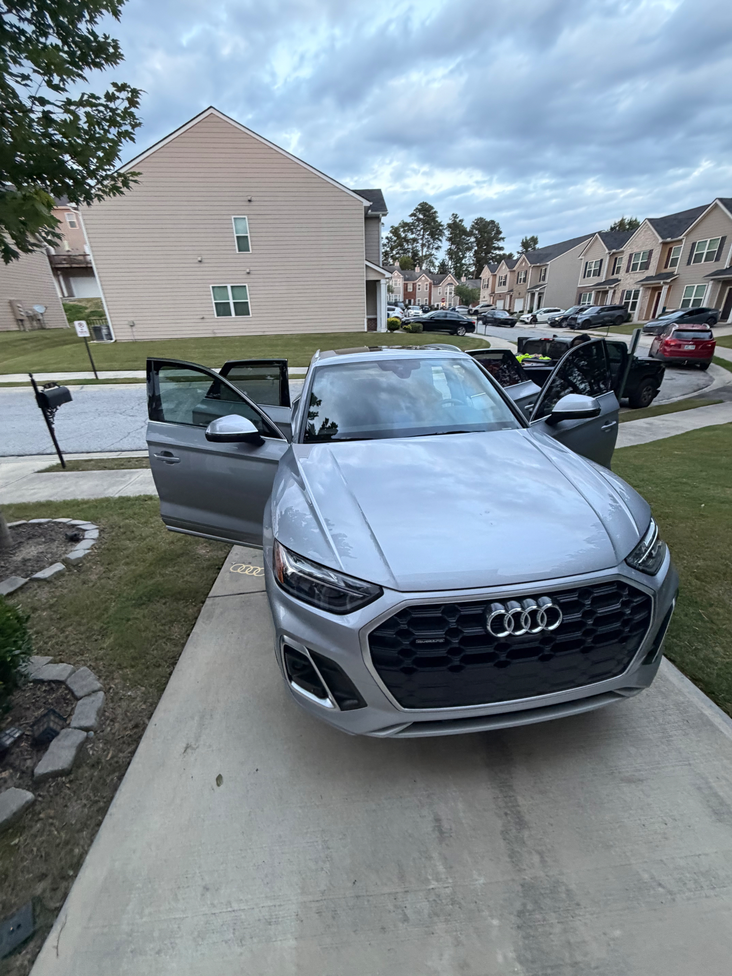 Silver Audi detailed at a residential driveway