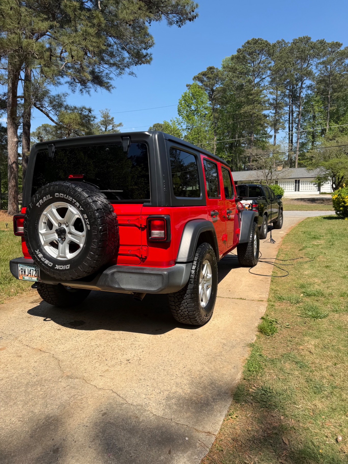 Red Jeep Wrangler after exterior detail in bright sun