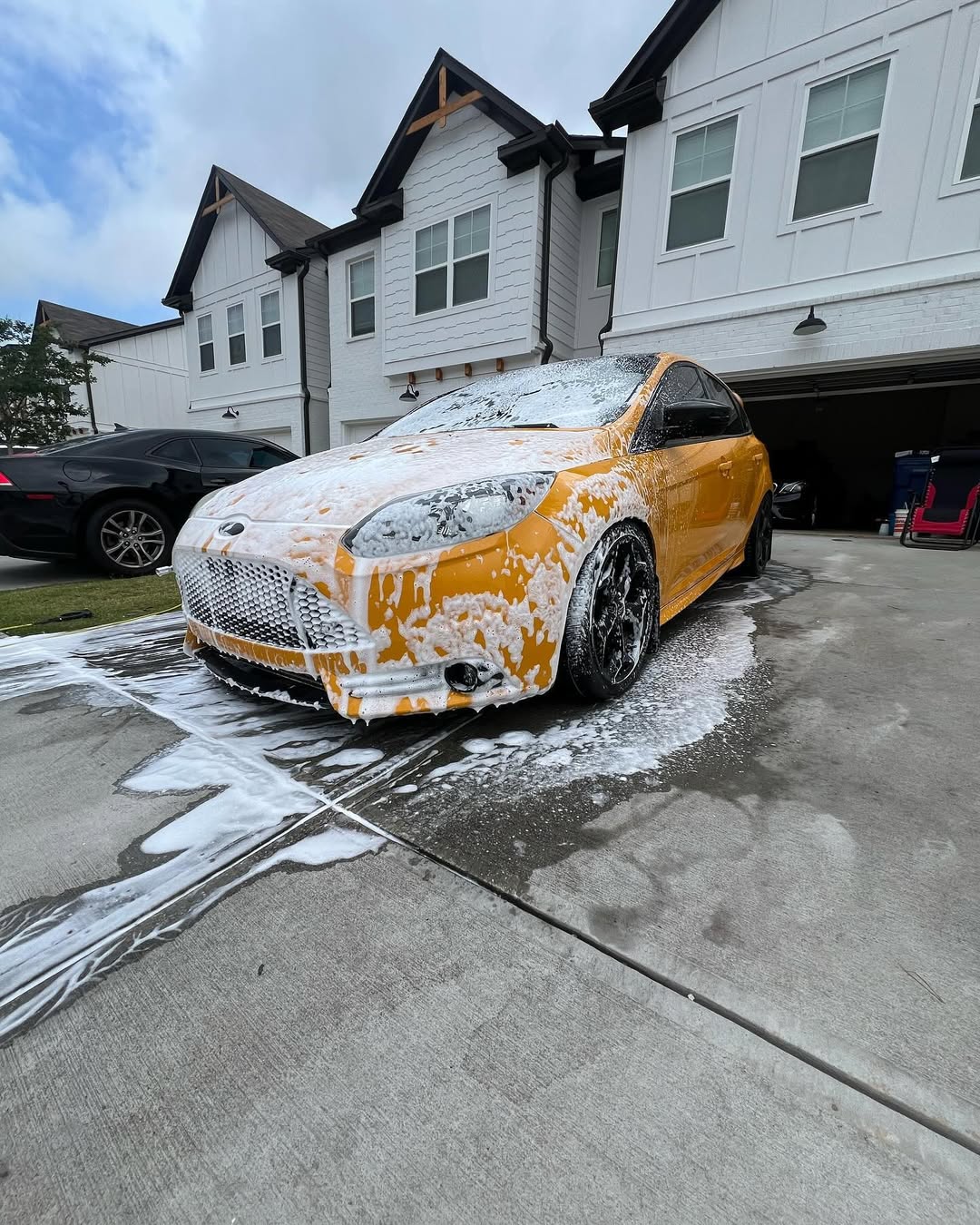 Ford Focus ST covered in foam during premium foam wash